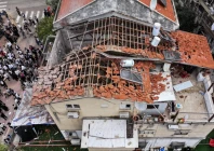 a drone view of people gathering at the site of damage in a residential neighbourhood following iranian missile barrages in central israel photo reuters