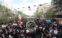 iran warns of retaliation if trump strikes us withdraws some personnel from bases