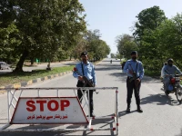 police officers stand at a check post on a road leading to the serena hotel as pakistan prepares to host the us and iran for peace talks in islamabad photo reuters