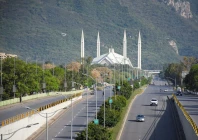 people commute on a road near faisal mosque as pakistan prepares to host the us and iran for peace talks in islamabad photo reuters