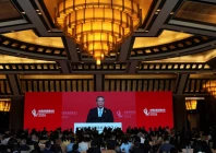 chinese premier li qiang is seen on a big screen live broadcasting his speech at the opening of the china development forum 2026 photo reuters