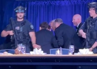 us president donald trump is escorted out as a shooter opens fire during the annual white house correspondents association dinner in washington dc photo reuters