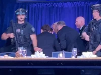 us president donald trump is escorted out as a shooter opens fire during the annual white house correspondents association dinner in washington dc photo reuters