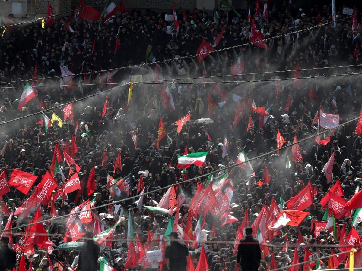 Mourners wave flags as they attend a public farewell ceremony to pay their respects to late supreme leader Ayatollah Ali Khamenei at the Imam Khomeini Grand Mosalla, in Tehran, Iran. Photo: Reuters