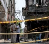 police officers stand at the site a day after a fire at a hotel in new delhi india photo reuters