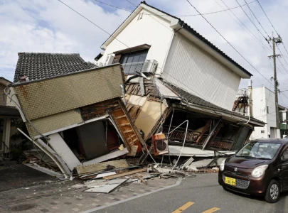 japan earthquake toll rises to 13 as rescuers haul people from collapsed mall