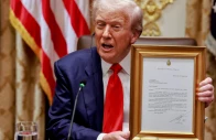 us president donald trump holds a framed letter from argentina s president javier milei stating that milei nominates trump for the nobel peace prize during lunch with milei in the cabinet room at the white house in washington dc photo reuters