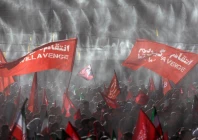 mourners wave flags under water sprinklers during a public farewell ceremony to pay their respects to late supreme leader ayatollah ali khamenei at the imam khomeini grand mosalla in tehran iran photo reuters