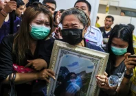 family members react as they receive the body of a victim at the police hospital morgue following a deadly fire at a pub in bangkok thailand photo reuters