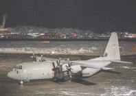 a royal danish air force lockheed c 130j super hercules is parked on the tarmac at nuuk international airport photo afp
