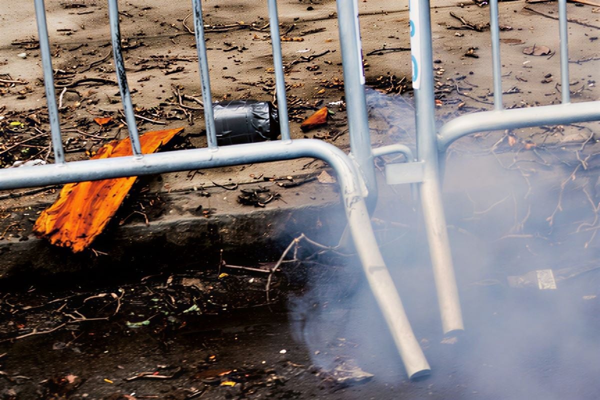 Smoke emits from an explosive device during an anti-Islam protest by supporters of far-right activist Jake Lang, which also drew counter protesters, outside Gracie Mansion, the official residence of New York Mayor Zohran Mamdani, in New York City, New York, U.S., March 7, 2026.PHOTO: REUTERS