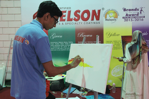 Students participate in painting competition at the expo. PHOTO: AYESHA MIR