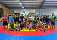 former youth olympics bronze medallist inayatullah left poses with young wrestlers during a training camp in lahore peshawar born inayatullah is one of five wrestlers set to fly to russia later this month for a month long training camp photo pwf