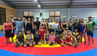 former youth olympics bronze medallist inayatullah left poses with young wrestlers during a training camp in lahore peshawar born inayatullah is one of five wrestlers set to fly to russia later this month for a month long training camp photo pwf