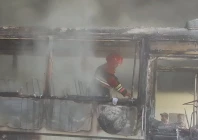 a rescue service official dousing the blaze inside a bus at the government college women university faisalabad on september 30 2026 photo express a rescue service official dousing the blaze inside a bus at the government college women university faisalabad on september 30 2026 photo express