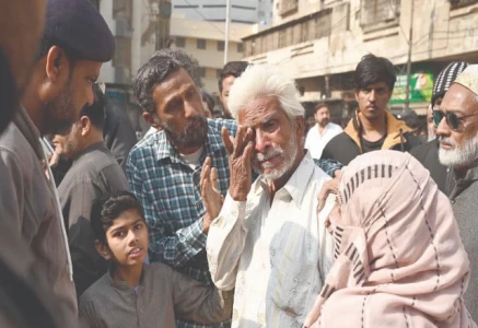 a family member of a gul plaza salesman wipes away tears while standing before the charred remains of the building mourning the loss of a lifetime of work and memories in the devastating fire photo app a family member of a gul plaza salesman wipes away tears while standing before the charred remains of the building mourning the loss of a lifetime of work and memories in the devastating fire photo app