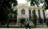 a policeman walks past the federal board of revenue fbr office building in islamabad on august 29 2018 photo reuters