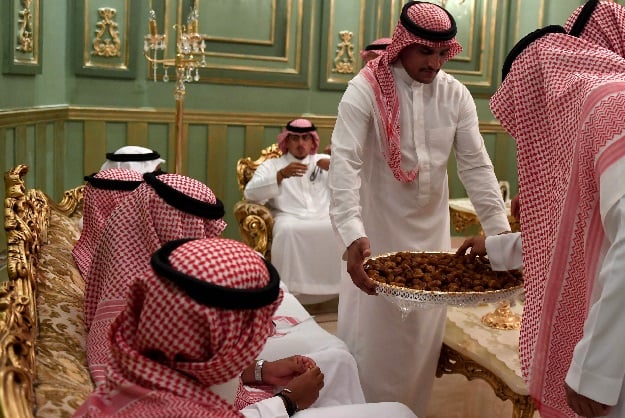 Saudi wedding like any other â clutching a decorative sword, the groom bobbed and swayed in a traditional dance. But there was one striking difference â a tiny guest list. PHOTO: AFP