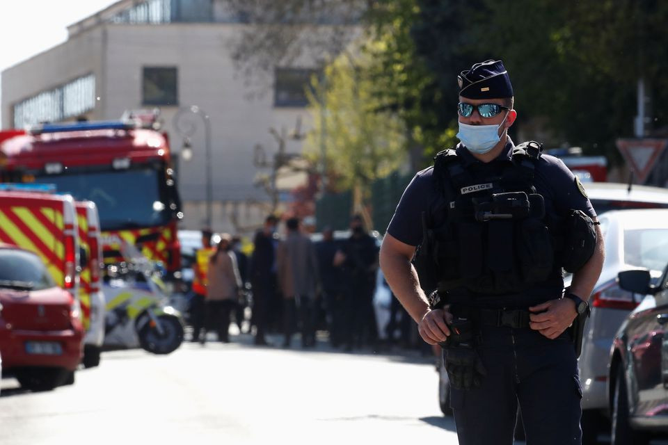 a police officer stands guard in the area where an attacker stabbed a female police administrative worker in rambouillet near paris france april 23 2021 photo reuters