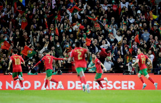 portugal and poland grab world cup finals spots