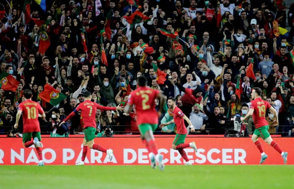 portugal and poland grab world cup finals spots