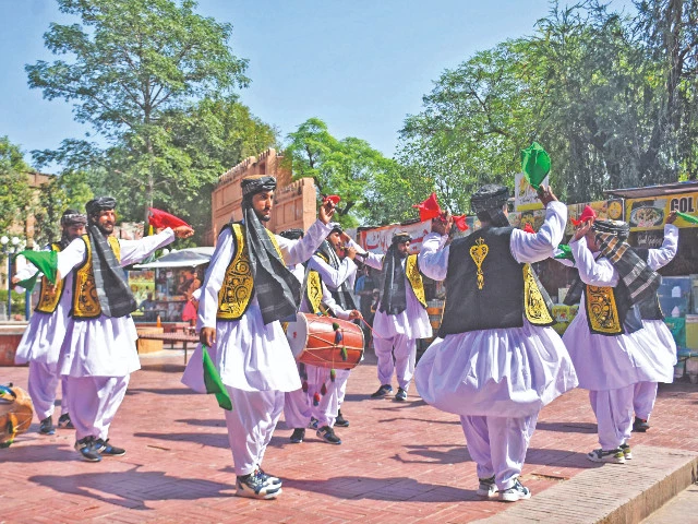 dancers perform a traditional balochi folk dance clad in regional festive attire at the three day balochistan grand tourism festival which was organised at lok virsa in the federal capital photo online dancers perform a traditional balochi folk dance clad in regional festive attire at the three day balochistan grand tourism festival which was organised at lok virsa in the federal capital photo online