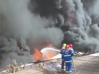 hazardous job firefighters try to douse a fire at a detergent factory in karachi s site area on tuesday photo nni