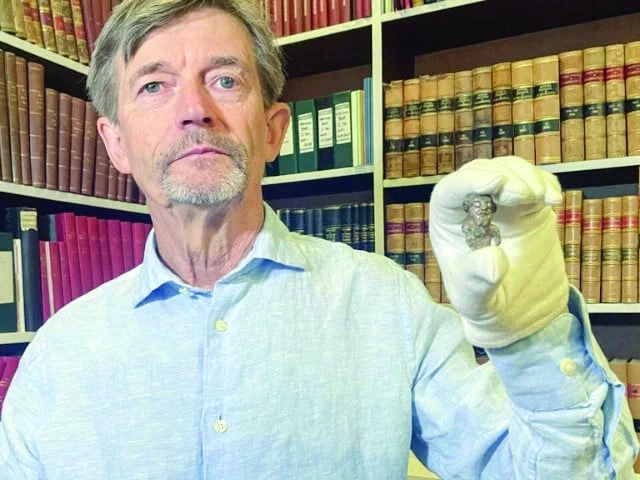 denmark s national museum curator peter pentz holds up an old figurine photo afp denmark s national museum curator peter pentz holds up an old figurine photo afp