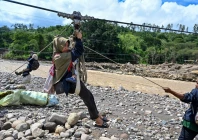 people use a rope to cross a river in the aftermath of flash floods that destroyed adjacent villages in ketol indonesia s aceh highland province on january 6 2026 photo afp people use a rope to cross a river in the aftermath of flash floods that destroyed adjacent villages in ketol indonesia s aceh highland province on january 6 2026 photo afp
