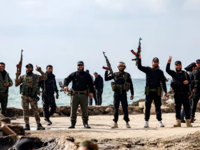 members of security forces loyal to the interim syrian government pose by the mediterranean coast in syria s western city of latakia photograph photo afp members of security forces loyal to the interim syrian government pose by the mediterranean coast in syria s western city of latakia photograph photo afp