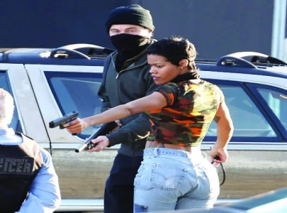 dicaprio opens fire in one battle after another dicaprio opens fire in one battle after another