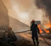 two dead hundreds evacuated from fires on island near athens