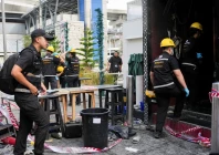 forensic police officials inspect the site of a deadly fire at a pub in bangkok thailand july 13 2026 photo reuters