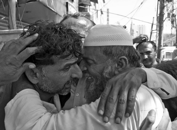 family members greet a fisherman released from indian jail on arrival at edhi centre karachi photo nni