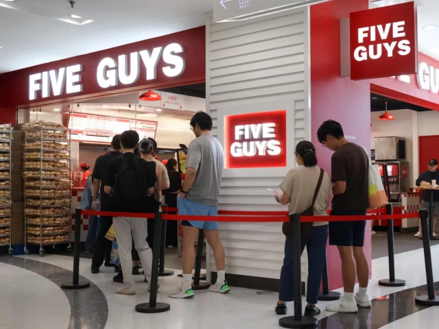 people queue at a five guys fast food restaurant after the us burger chain opened its first two locations earlier this month in beijing china august 15 2026 photo reuters people queue at a five guys fast food restaurant after the us burger chain opened its first two locations earlier this month in beijing china august 15 2026 photo reuters