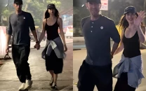 dakota johnson and chris martin hold hands and visit temple in india amid breakup rumours
