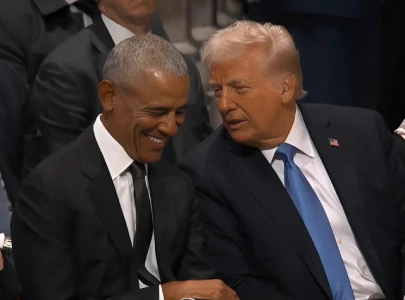 donald trump and barack obama s secret conversation at jimmy carter s funeral deciphered