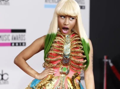 nicki minaj reveals title of intro track and release date for upcoming album with cryptic ai imagery