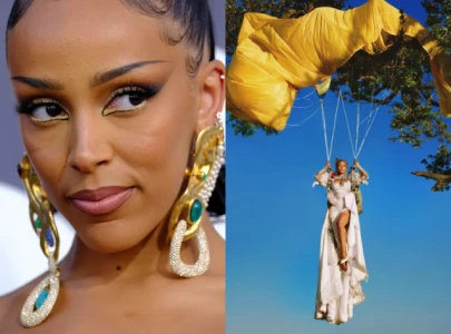 doja cat defends vie album cover amid mixed reaction from fans it s the perfect cover
