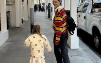 gigi hadid shares photos with daughter khai while boyfriend bradley cooper attends super bowl 2025