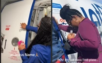 jetblue passenger anoints plane with holy water in viral video amid rising plane crashes