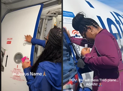 jetblue passenger anoints plane with holy water in viral video amid rising plane crashes jetblue passenger anoints plane with holy water in viral video amid rising plane crashes