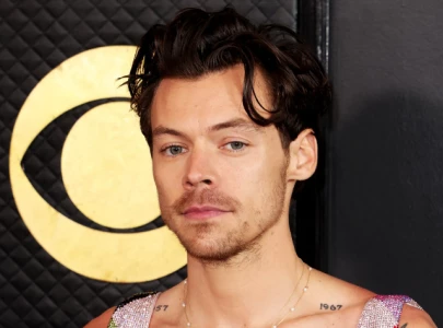 harry styles sparks romance rumours with mystery woman in glastonbury vip area