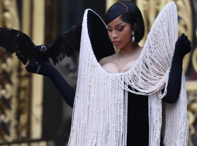 cardi b s pearl fringe schiaparelli look and crow turn heads during couture week appearance in paris cardi b s pearl fringe schiaparelli look and crow turn heads during couture week appearance in paris