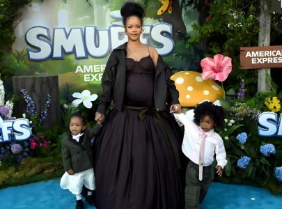 rihanna s son riot steals the spotlight in custom dior at smurfs la premiere rihanna s son riot steals the spotlight in custom dior at smurfs la premiere