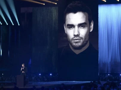 one direction member louis tomlinson and fans react to liam payne tribute at 2025 brit awards