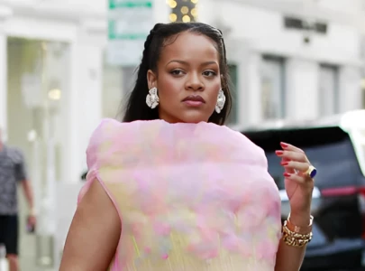 rihanna turns heads in puma x ottolinger sneakers and cotton candy dress in la rihanna turns heads in puma x ottolinger sneakers and cotton candy dress in la