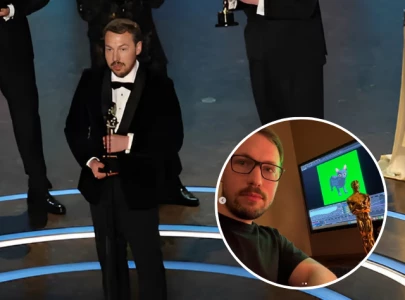 flow director celebrates oscar win by recreating viral spinning cat meme flow director celebrates oscar win by recreating viral spinning cat meme