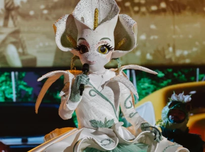 calla lily unmasked on the masked singer season 14 as panel divides over final guesses