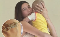 hailey bieber adds personalised anklet to jewellery collection inspired by son jack blues